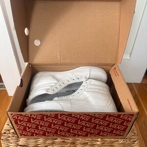 Vans All-White High-Top Sneakers (size 9 Women’s, size 7.5 Men’s)
